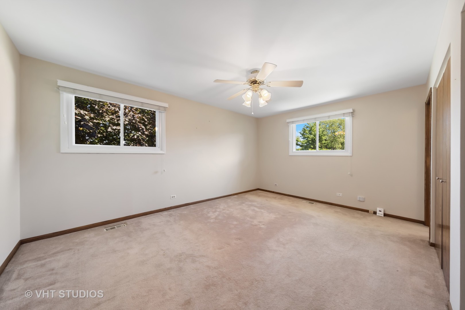 1623 South Prospect Street Wheaton, IL 60189 - Photo 12 of 26 an empty room with windows and ceiling fan