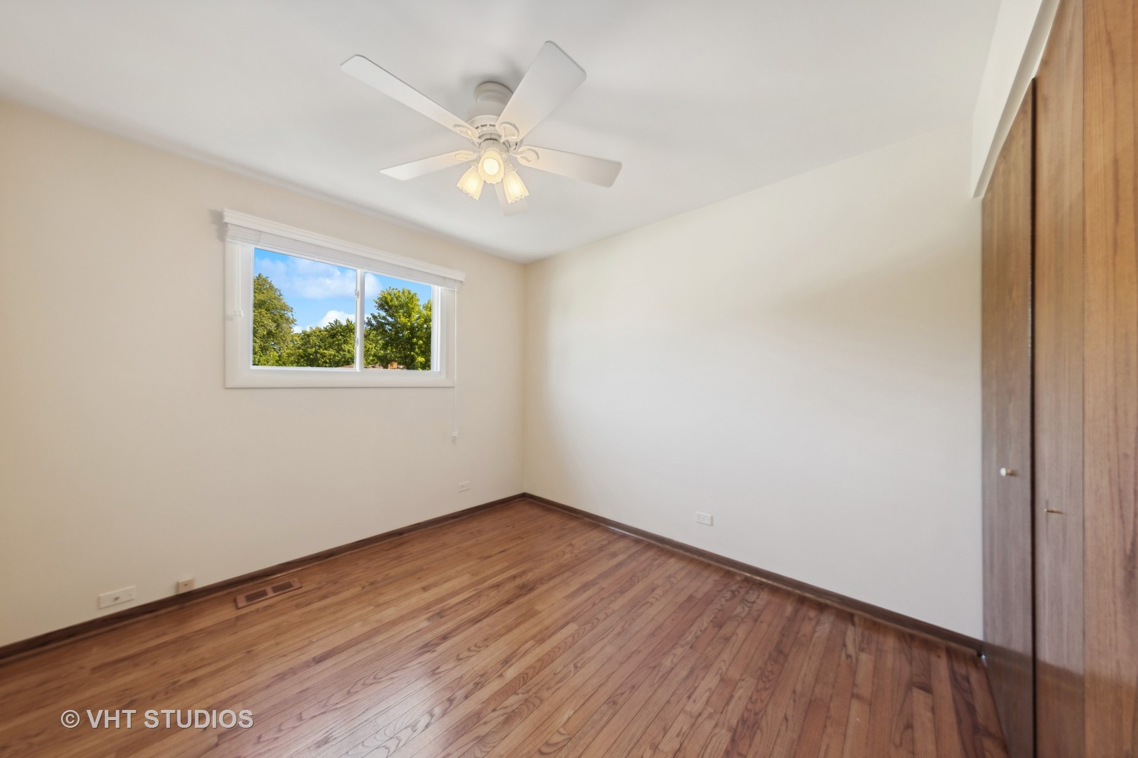 1623 South Prospect Street Wheaton, IL 60189 - Photo 15 of 26 a view of an empty room with wooden floor and a window