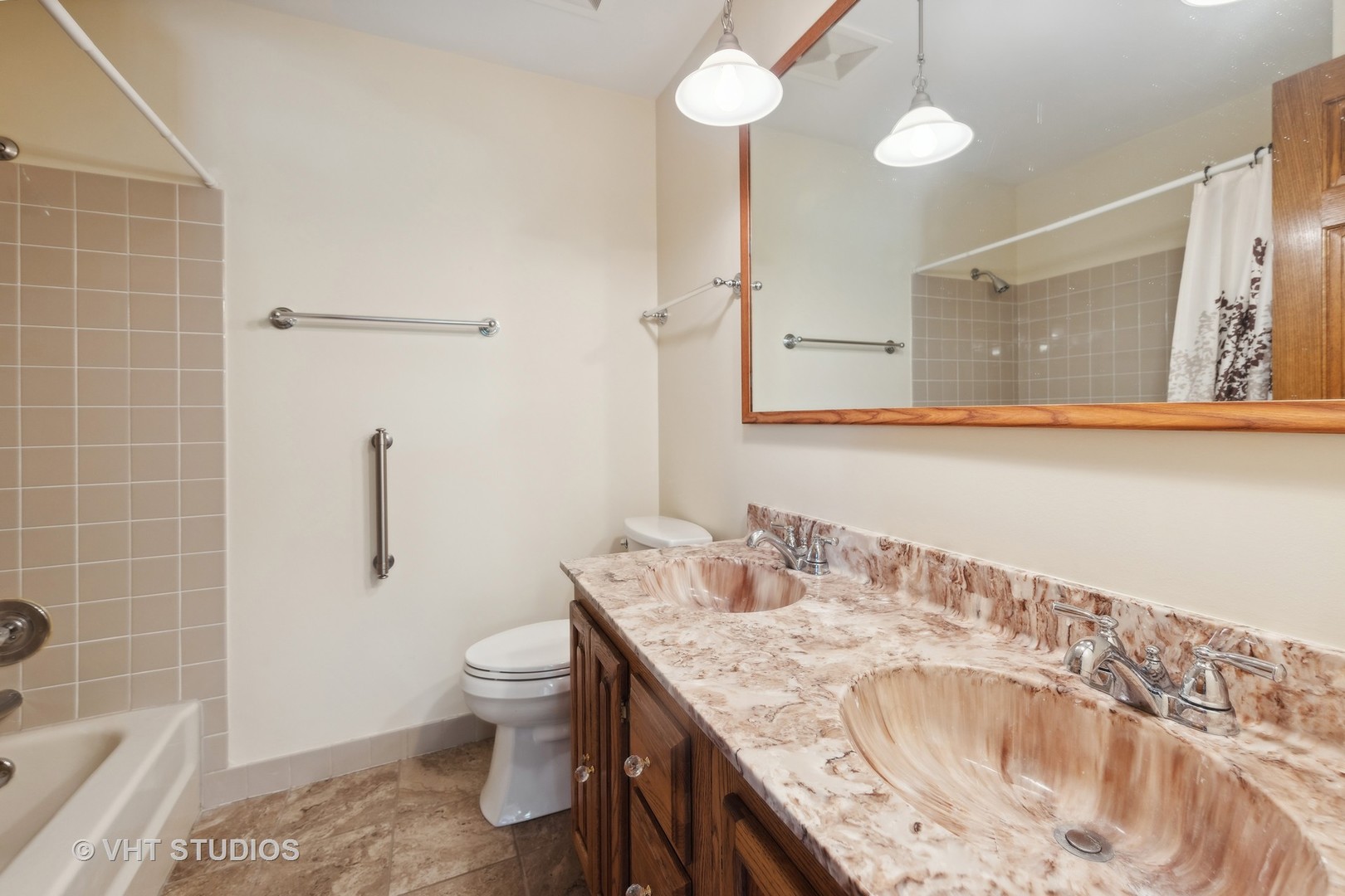 1623 South Prospect Street Wheaton, IL 60189 - Photo 17 of 26 a bathroom with a granite countertop sink a toilet and shower