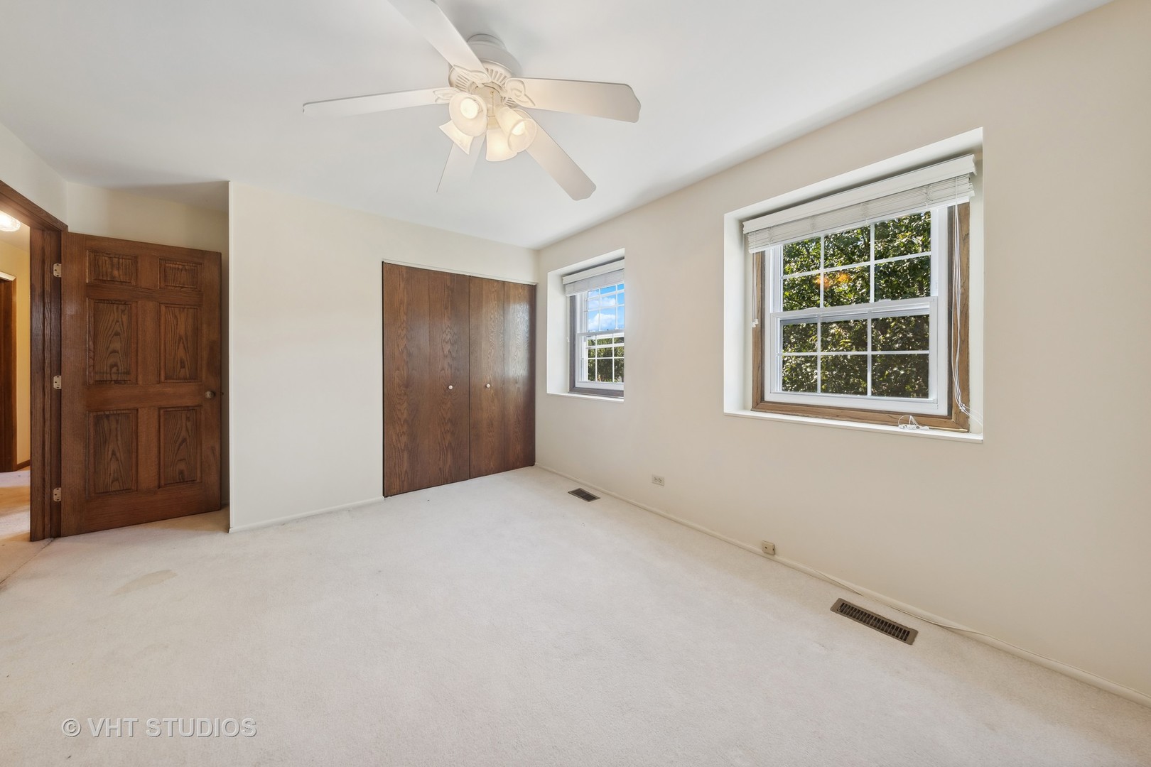1623 South Prospect Street Wheaton, IL 60189 - Photo 18 of 26 an empty room with windows and closet