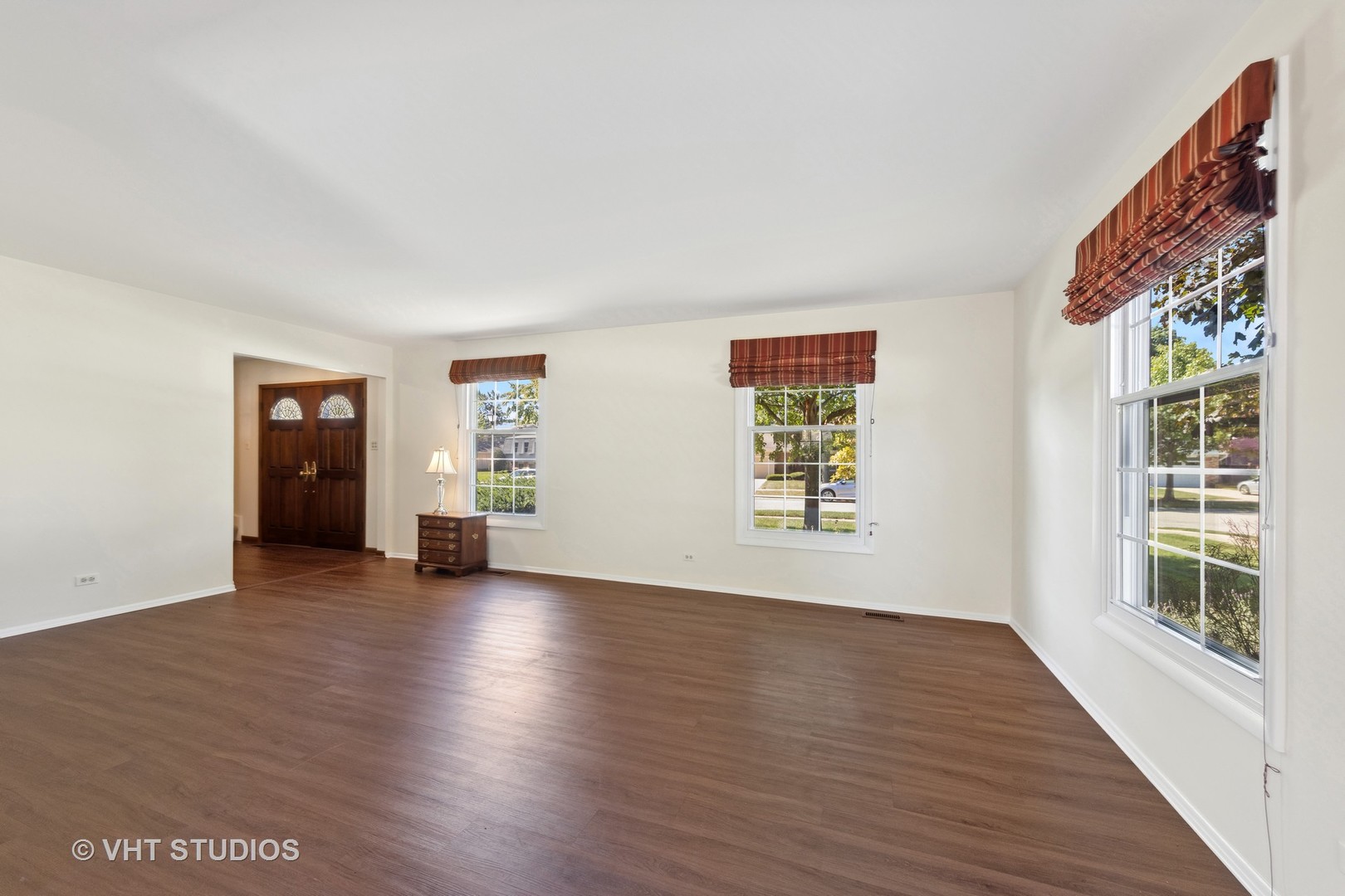 1623 South Prospect Street Wheaton, IL 60189 - Photo 5 of 26 an empty room with wooden floor and windows
