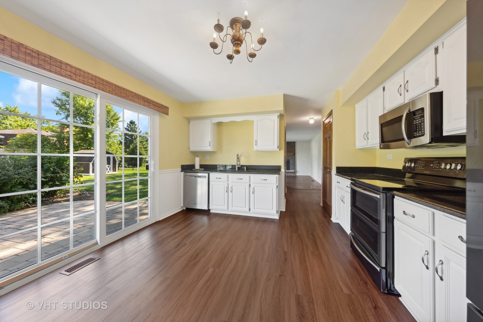 1623 South Prospect Street Wheaton, IL 60189 - Photo 8 of 26 a large kitchen with cabinets wooden floor and stainless steel appliances