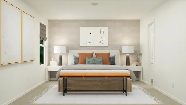 a bedroom with a bed and chair