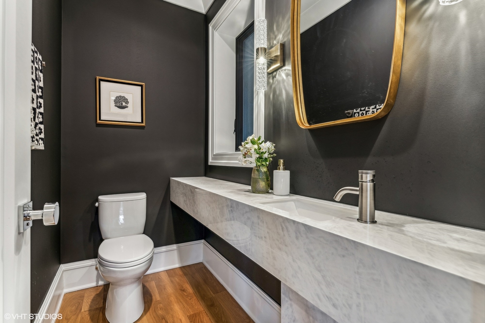 2034 North Mohawk Street, Unit 1 Chicago, IL 60614 - Photo 11 of 26 a bathroom with a toilet a sink and mirror