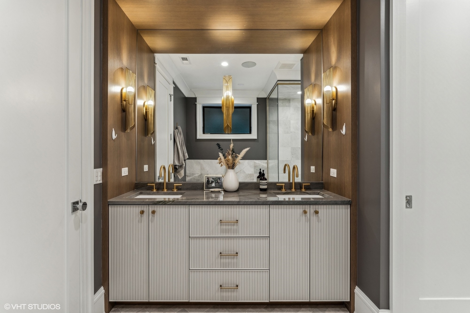 2034 North Mohawk Street, Unit 1 Chicago, IL 60614 - Photo 15 of 26 a bathroom with a sink and a mirror