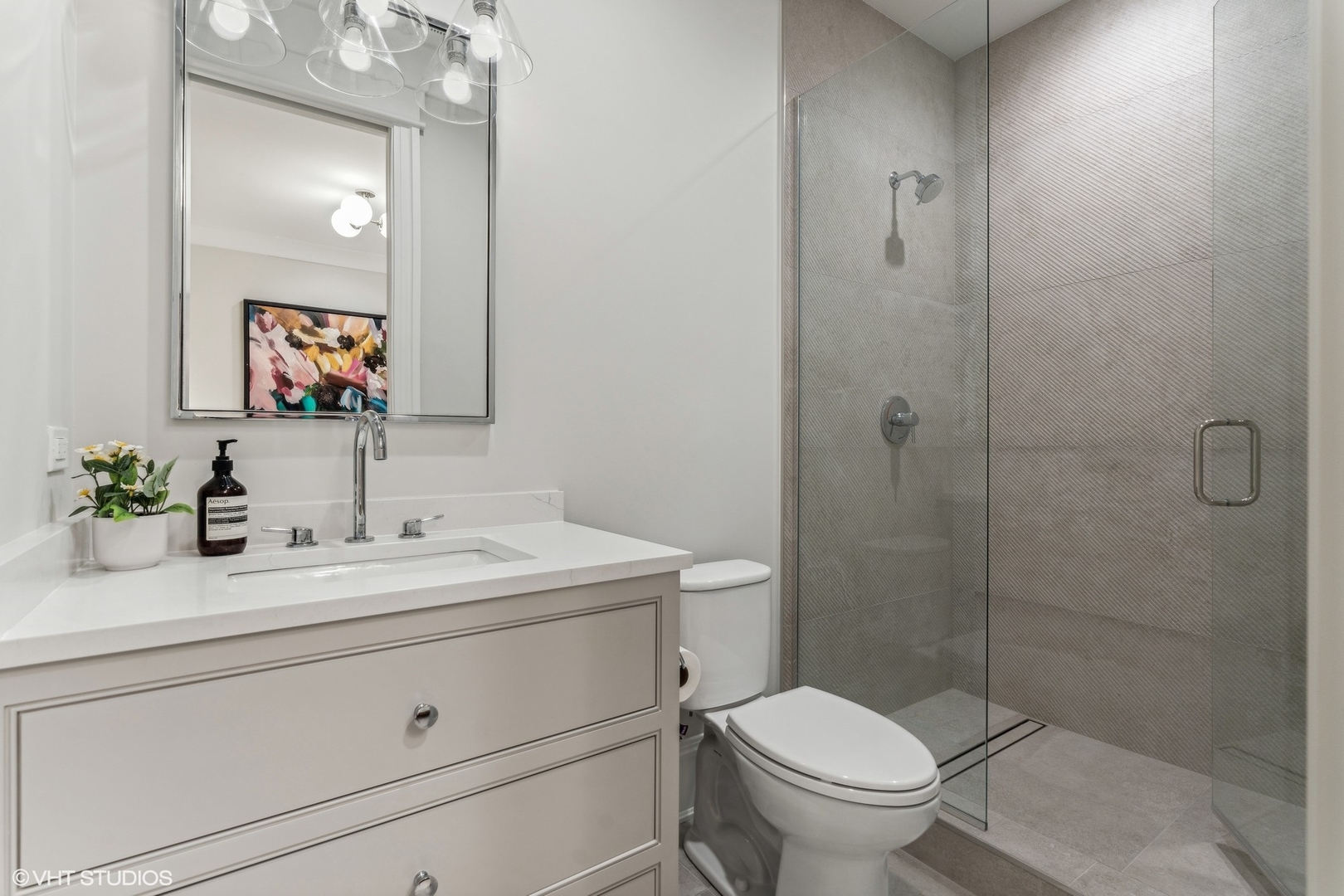 2034 North Mohawk Street, Unit 1 Chicago, IL 60614 - Photo 18 of 26 a bathroom with a toilet a sink and mirror