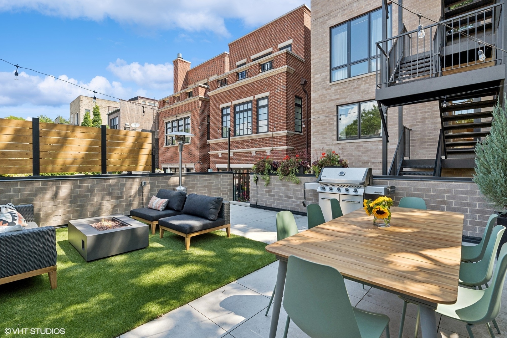 2034 North Mohawk Street, Unit 1 Chicago, IL 60614 - Photo 24 of 26 a view of a patio with couches table and chairs and potted plants