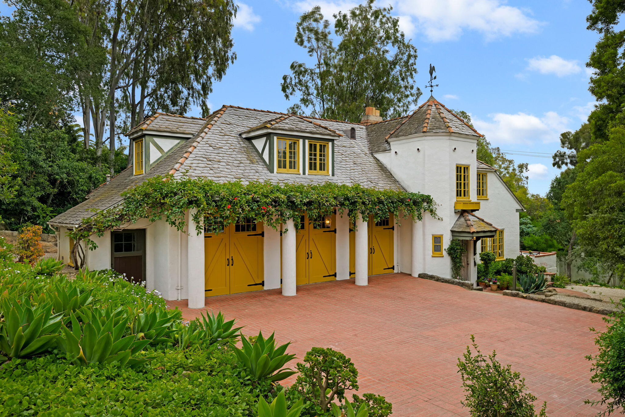2040 Mission Ridge Road Santa Barbara, CA 93103 - Photo 1 of 38 a front view of a house with garden