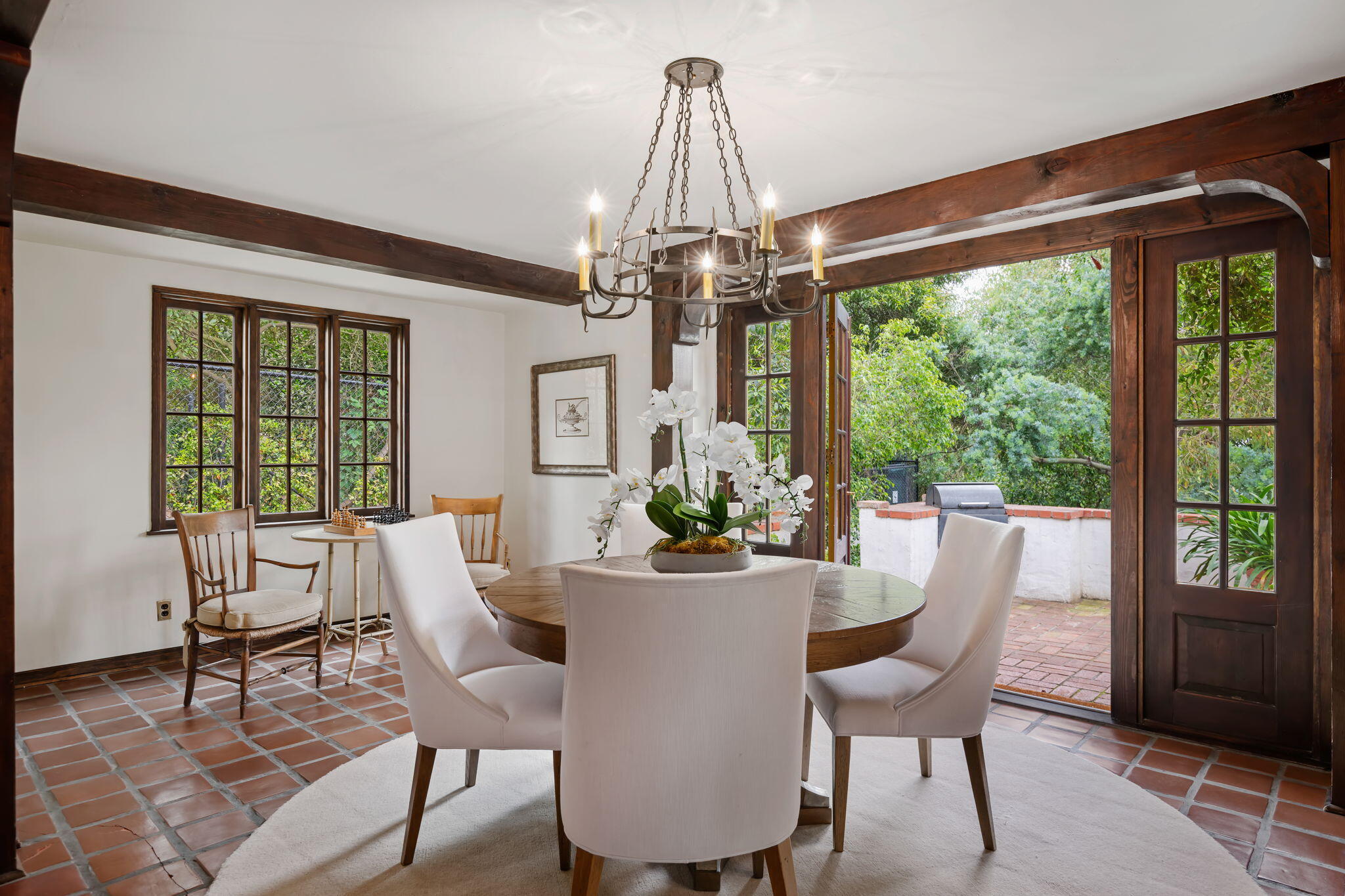 2040 Mission Ridge Road Santa Barbara, CA 93103 - Photo 15 of 38 a dining room with furniture a chandelier and wooden floor