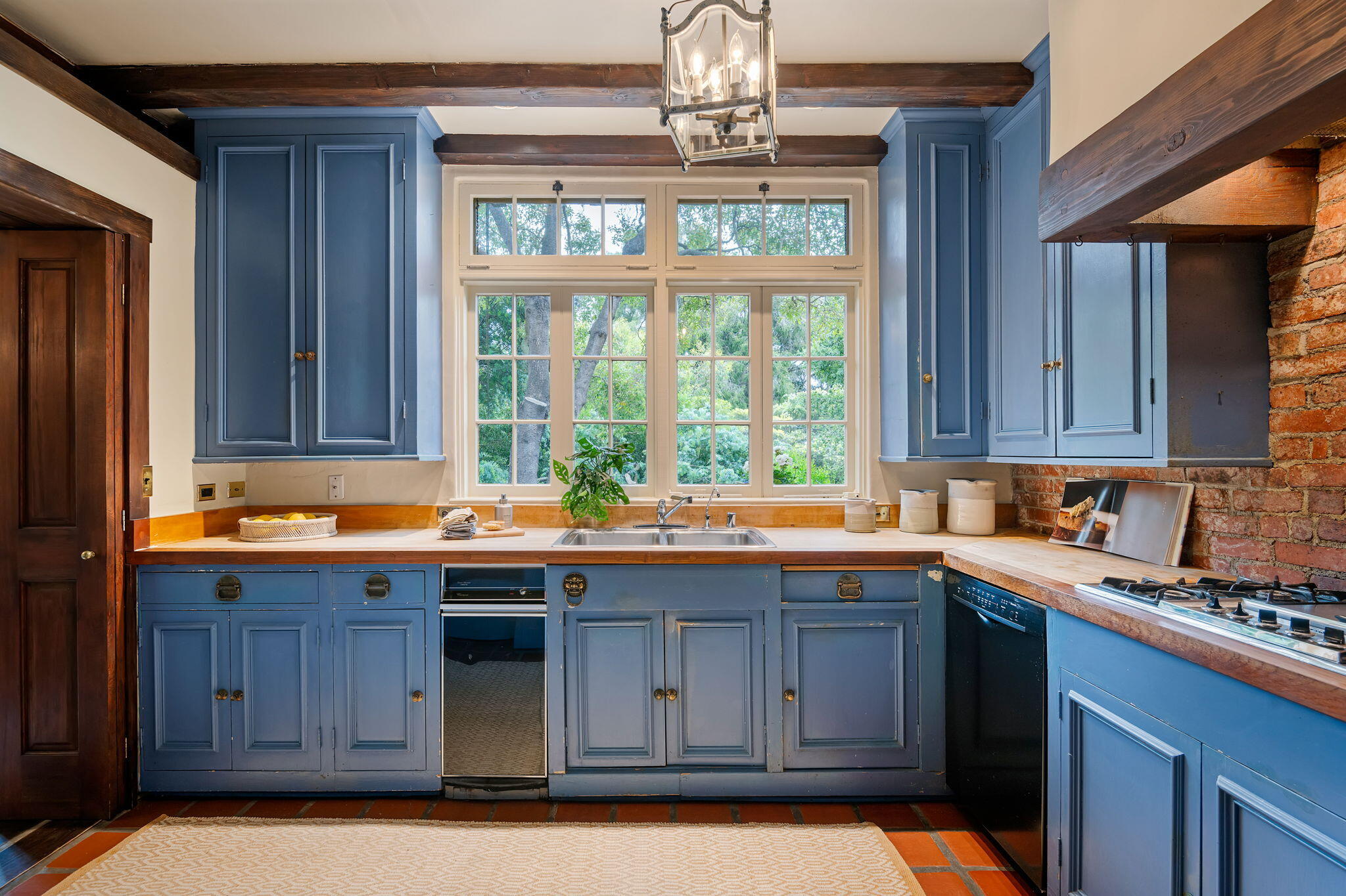 2040 Mission Ridge Road Santa Barbara, CA 93103 - Photo 21 of 38 a kitchen with a sink window and cabinets