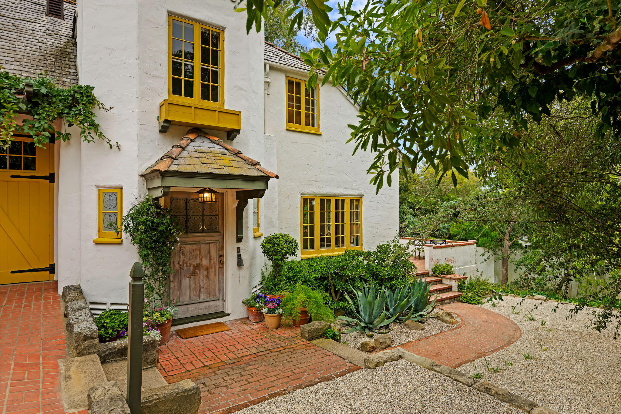 2040 Mission Ridge Road Santa Barbara, CA 93103 - Photo 6 of 38 a front view of a house with a yard