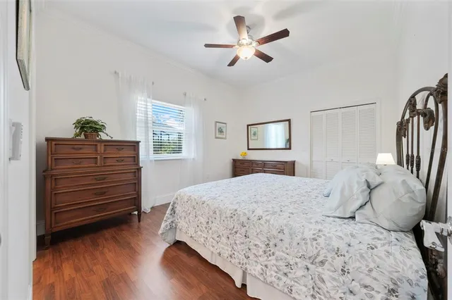 an aerial view of a house with a yard and large trees