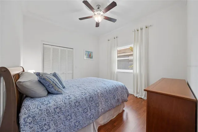 a dining hall with stainless steel appliances kitchen island granite countertop a dining table chairs and a sink