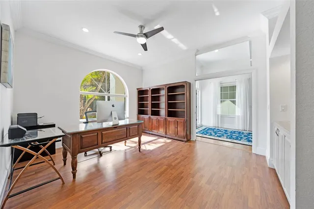 a large kitchen with stainless steel appliances kitchen island a large counter top and a wooden floors