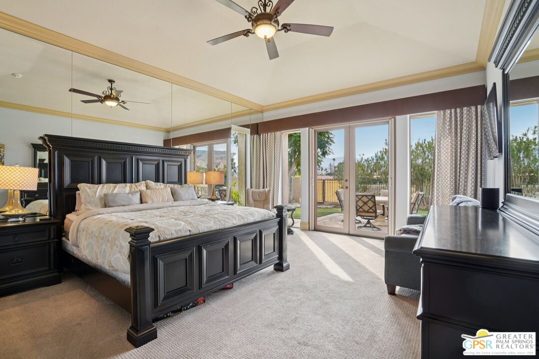 20 Clancy Lane Estates Rancho Mirage, CA 92270 - Photo 34 of 75 a spacious bedroom with a large bed and a large window