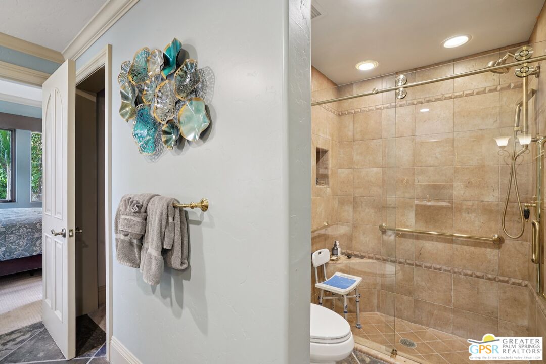 20 Clancy Lane Estates Rancho Mirage, CA 92270 - Photo 44 of 75 a bathroom with a granite countertop shower a toilet and a sink