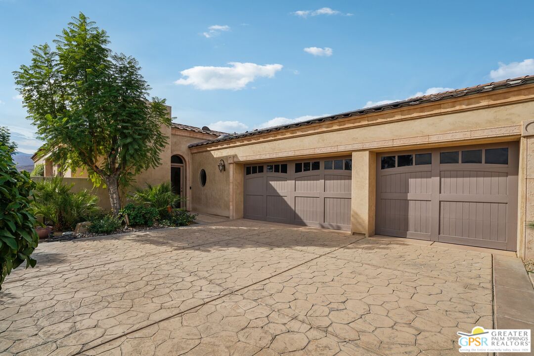 20 Clancy Lane Estates Rancho Mirage, CA 92270 - Photo 67 of 75 a front view of a house with a yard and garage