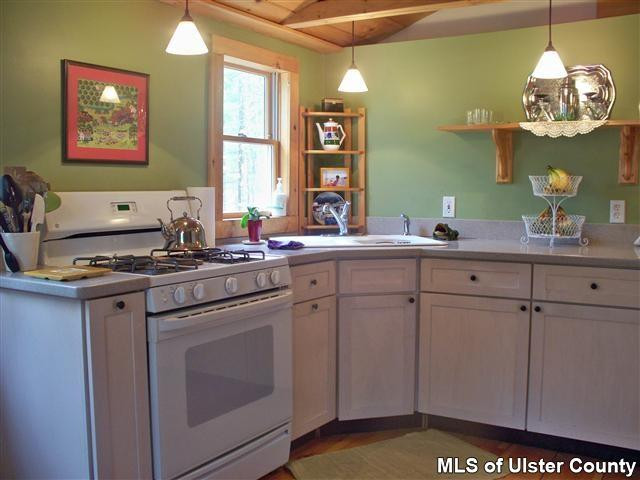 528 Peak Road Stone Ridge, NY 12484 - Photo 4 of 17 a kitchen with cabinets and window