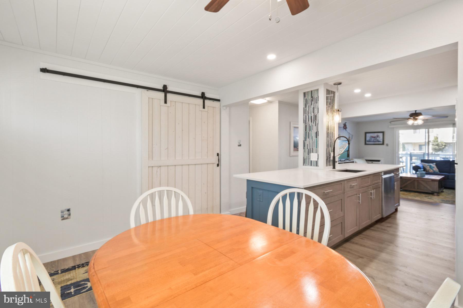 722 Mooring Road, Unit A104 Ocean City, MD 21842 - Photo 5 of 33 a large white kitchen with a large window