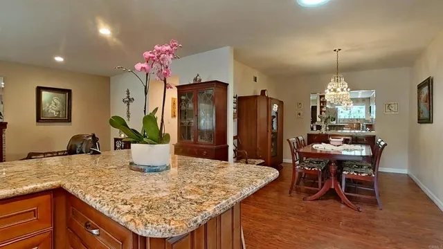 a dining table with a potted plant kitchen table and chairs