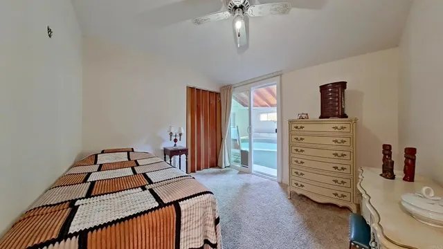 a bedroom with a bed and a closet