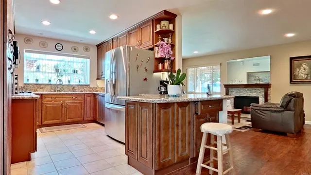 a kitchen with a refrigerator and a sink