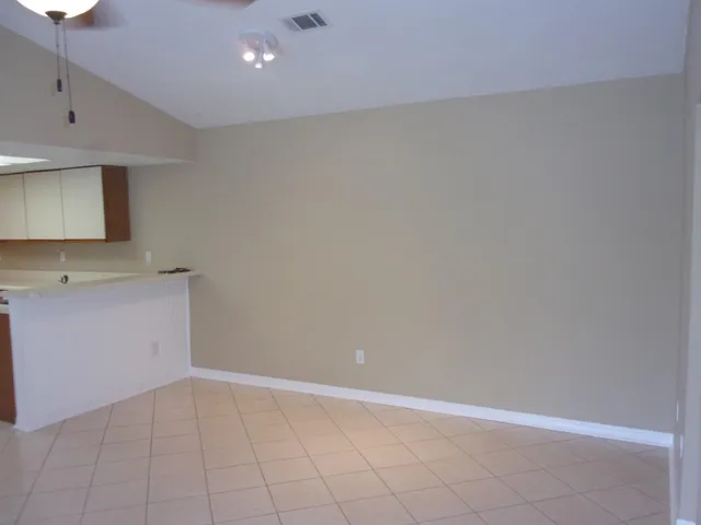 a kitchen with a sink a stove and cabinets