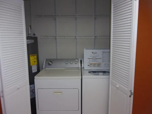 a kitchen with a stove top oven and cabinets