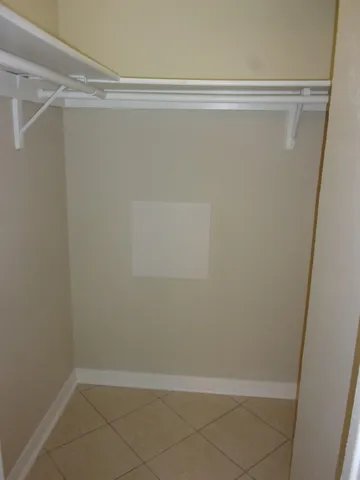 a bathroom with a granite countertop toilet a sink and a shower