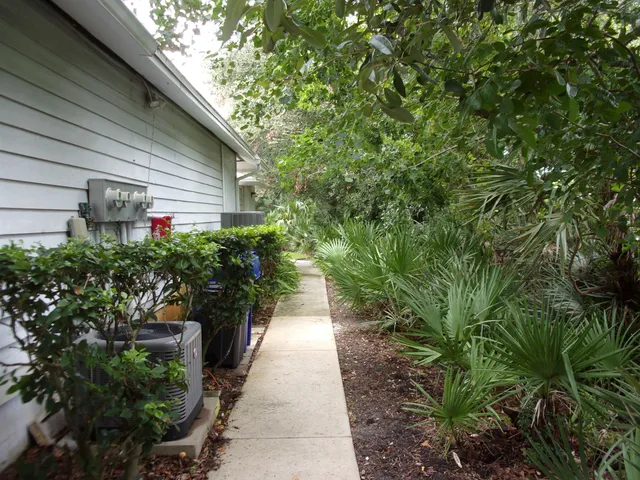 a view of cars parked in front of a house