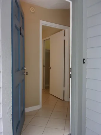 a view of an empty room with a window
