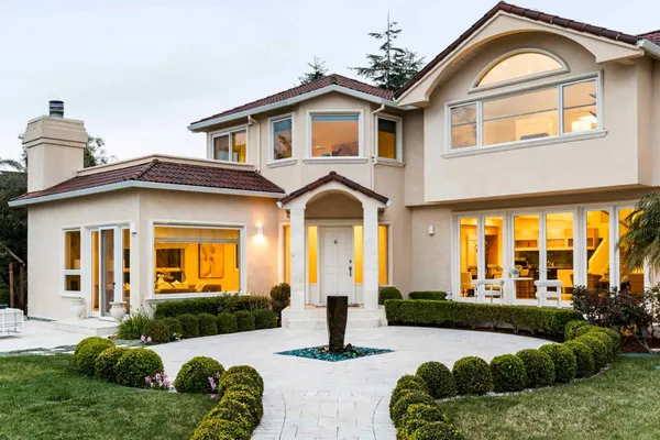 a front view of a house with a yard
