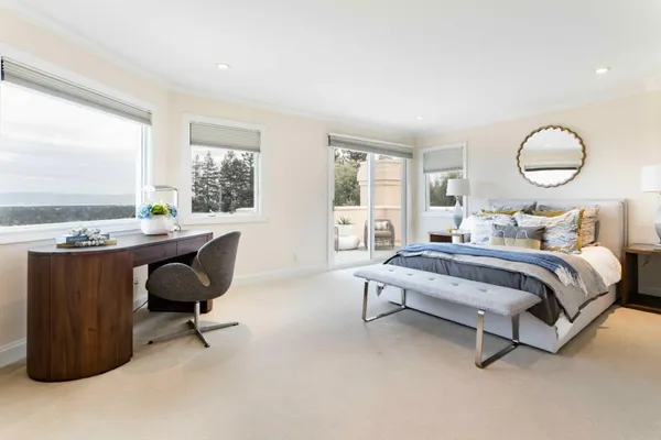 a bedroom with bed and a window