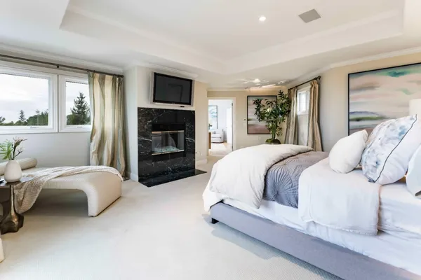 a bedroom with a bed and a fireplace