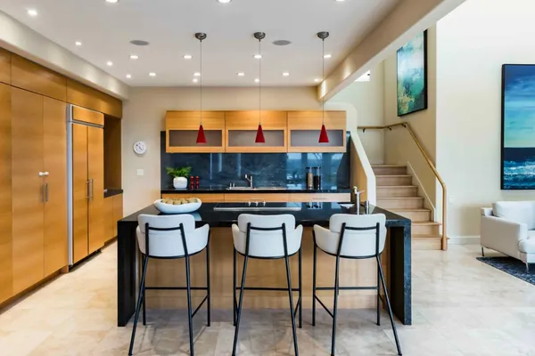 a kitchen with a table and chairs