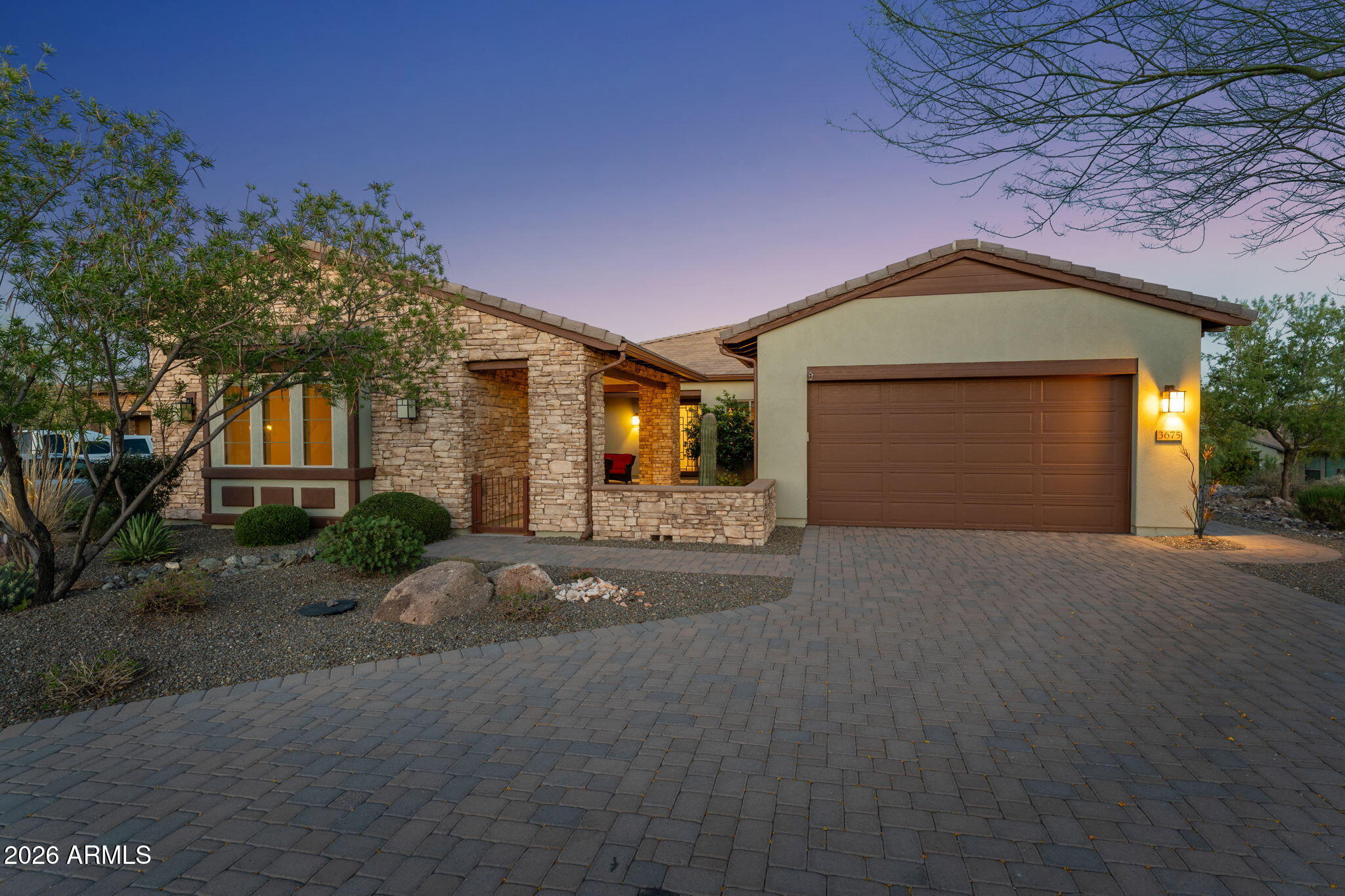 3675 Gold Ridge Road Wickenburg, AZ 85390 - Photo 7 of 58 a front view of a house with a yard and garage