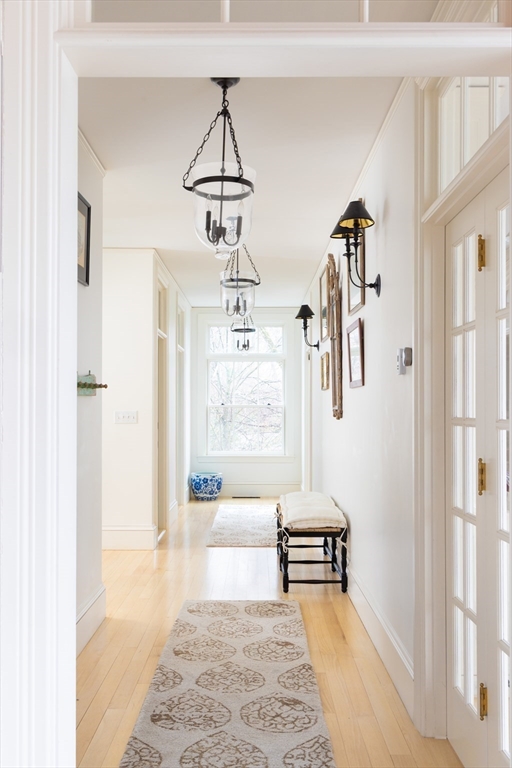 371 Walnut Street Brookline, MA 02445 - Photo 13 of 40 a living room with furniture and a chandelier