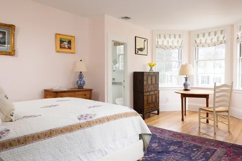 a bedroom with a bed and furniture