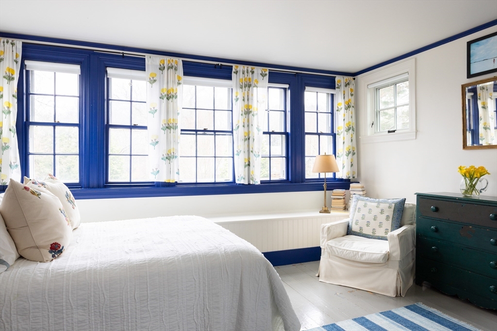 371 Walnut Street Brookline, MA 02445 - Photo 23 of 40 a bedroom with a bed and a couch next to a window