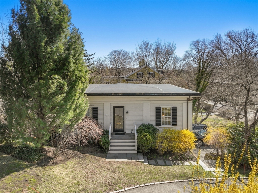 371 Walnut Street Brookline, MA 02445 - Photo 32 of 40 a front view of a house with garden
