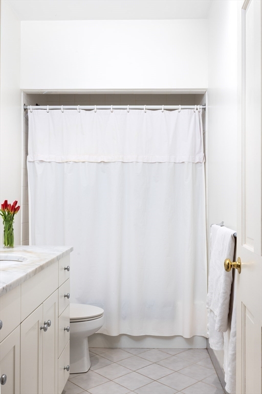 371 Walnut Street Brookline, MA 02445 - Photo 36 of 40 a bathroom with a sink and a mirror