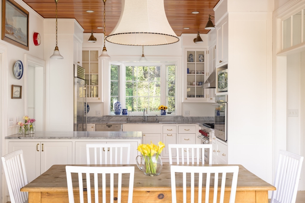 371 Walnut Street Brookline, MA 02445 - Photo 9 of 40 a bathroom with a tub sink and mirror