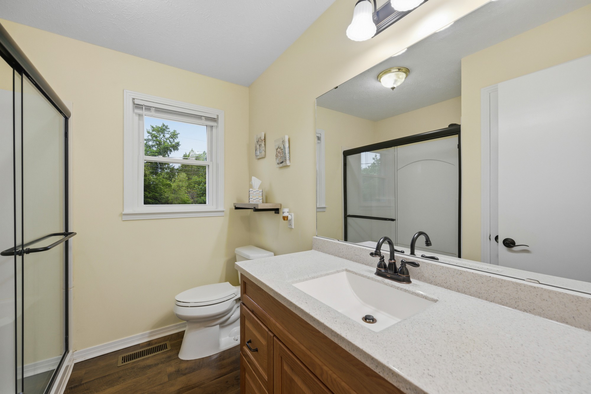 944 Brooksie Thompson Road Decaturville, TN 38329 - Photo 12 of 47 a bathroom with a sink a toilet and mirror