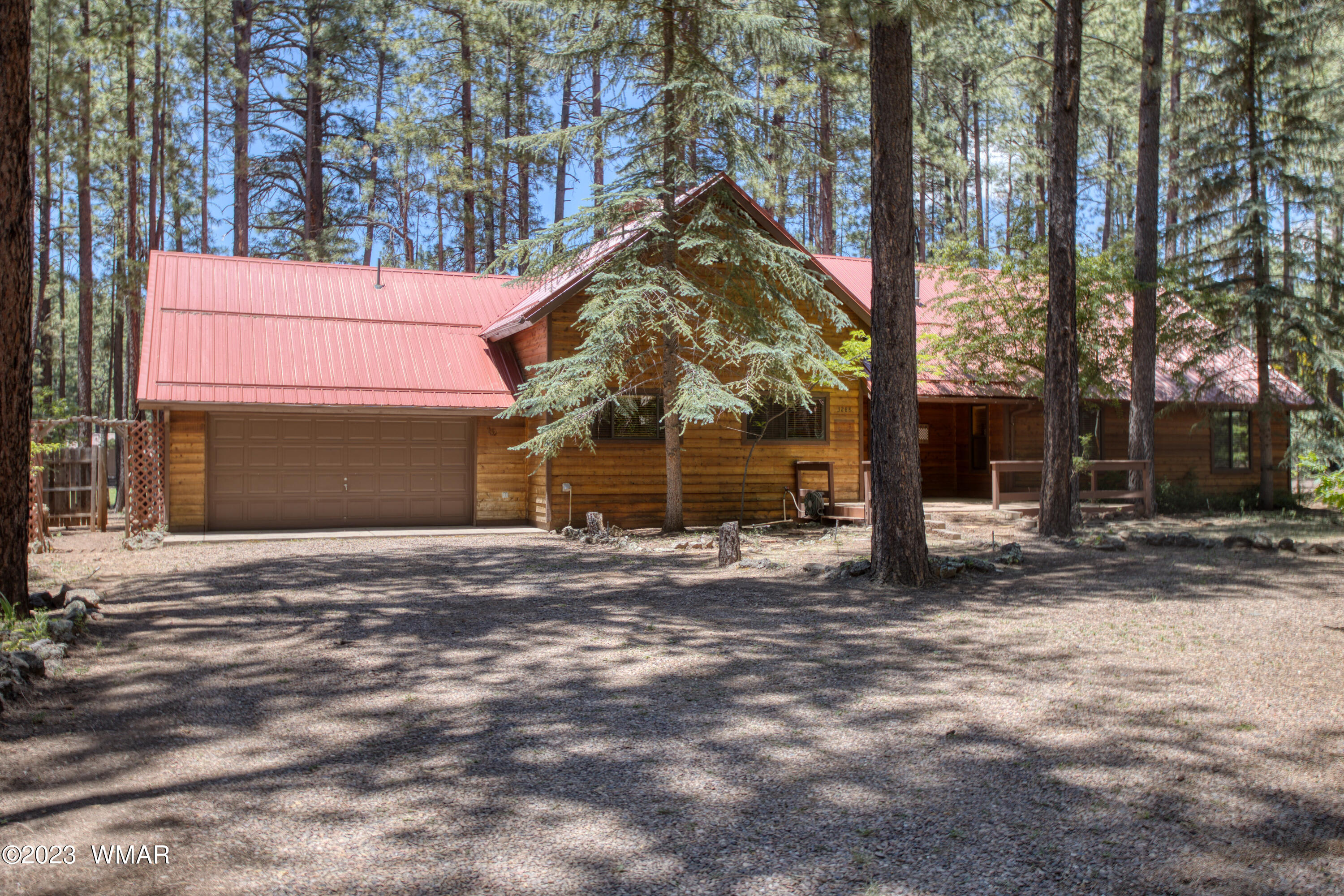 3288 Lake View Drive Pinetop, AZ 85935 - Photo 1 of 32 a front view of a house with a yard