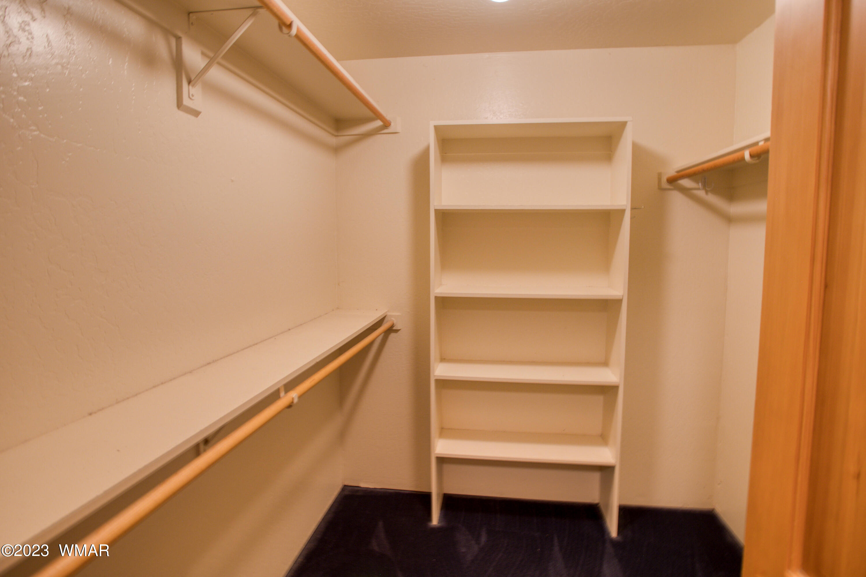 3288 Lake View Drive Pinetop, AZ 85935 - Photo 13 of 32 a view of walk in closet with empty racks