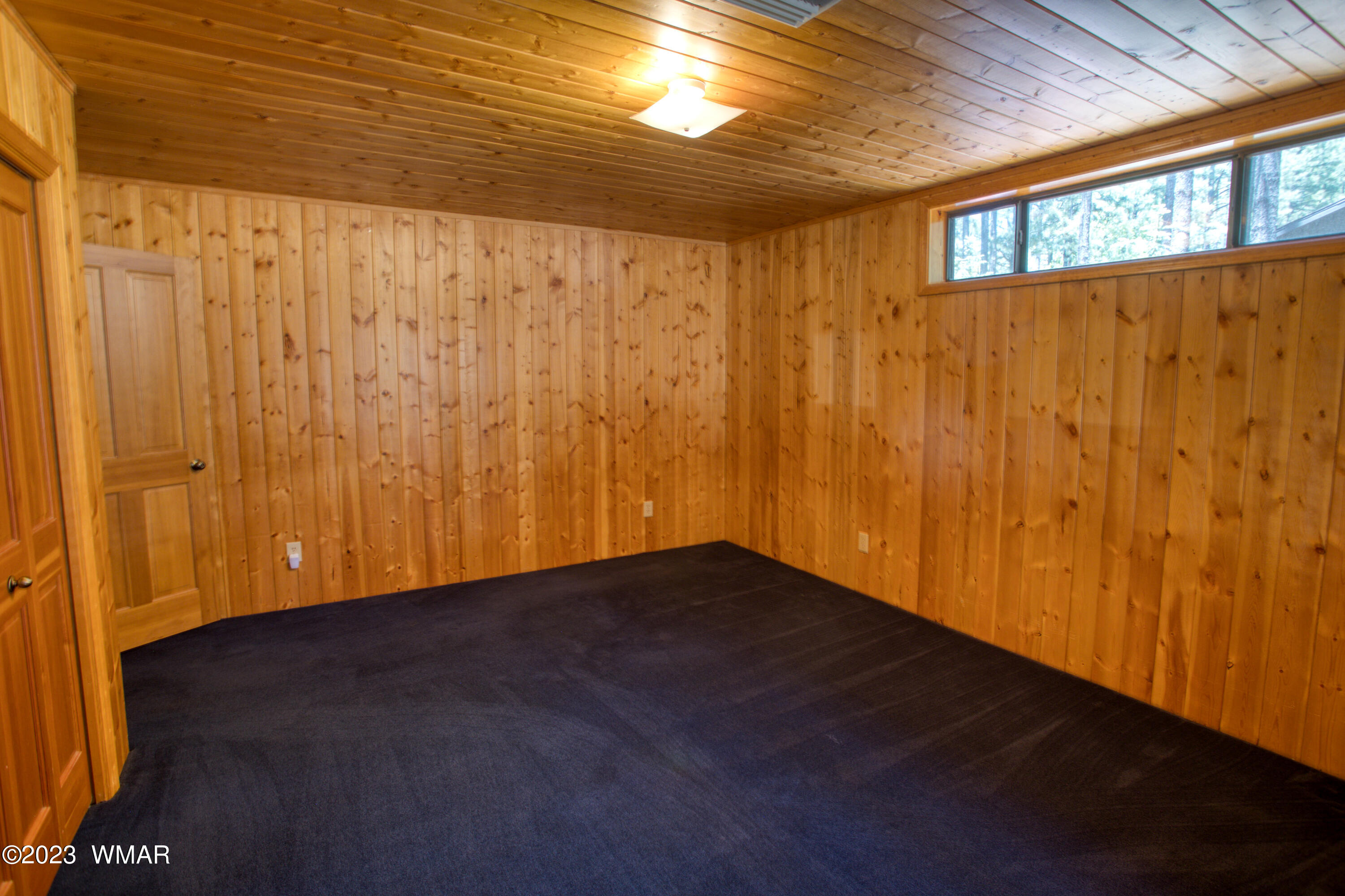 3288 Lake View Drive Pinetop, AZ 85935 - Photo 20 of 32 a view of an empty room with wooden floor