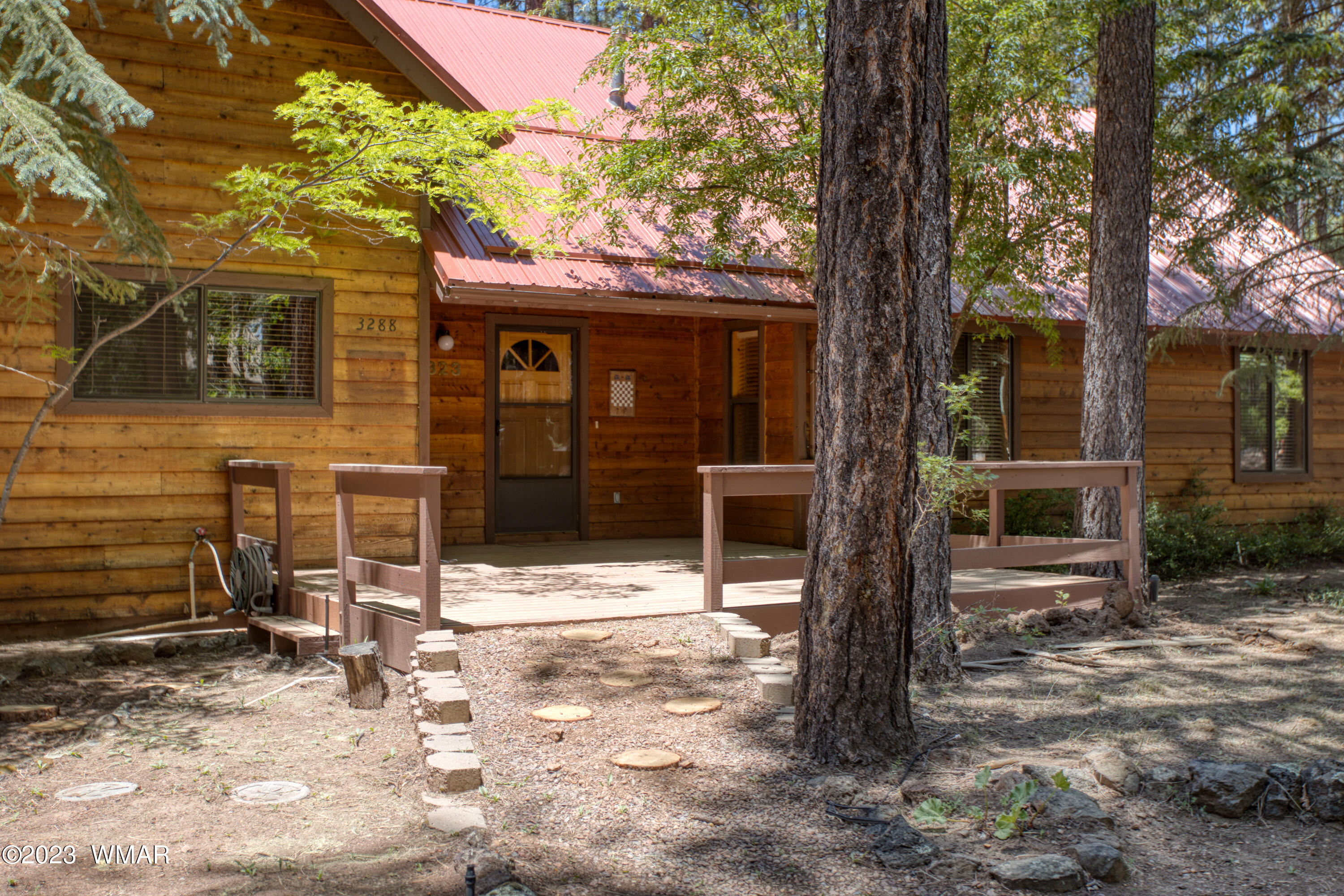 3288 Lake View Drive Pinetop, AZ 85935 - Photo 2 of 32 a front view of a house with garden