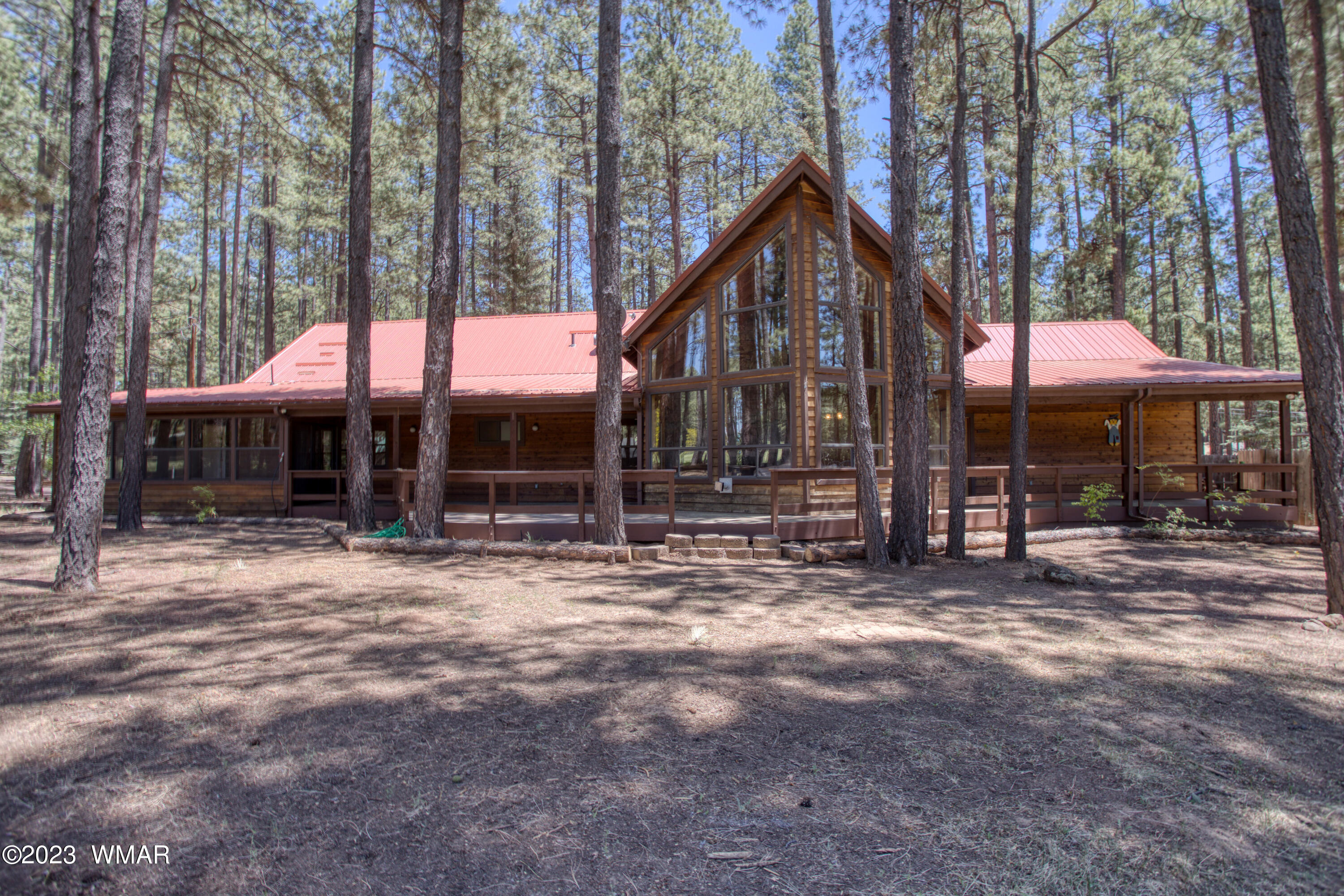 3288 Lake View Drive Pinetop, AZ 85935 - Photo 30 of 32 a view of a house with backyard and sitting area