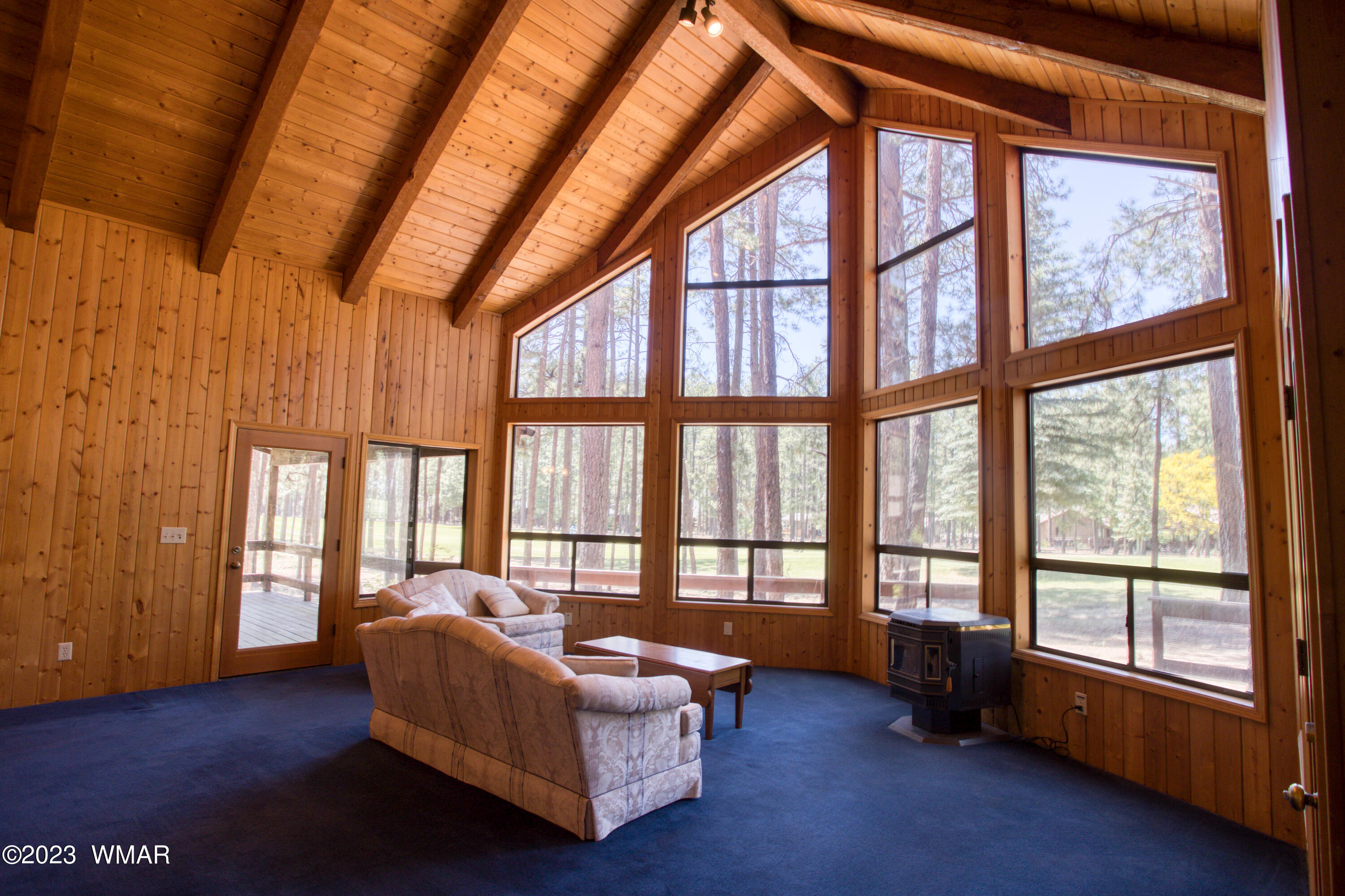 3288 Lake View Drive Pinetop, AZ 85935 - Photo 3 of 32 a living room with furniture and a large window