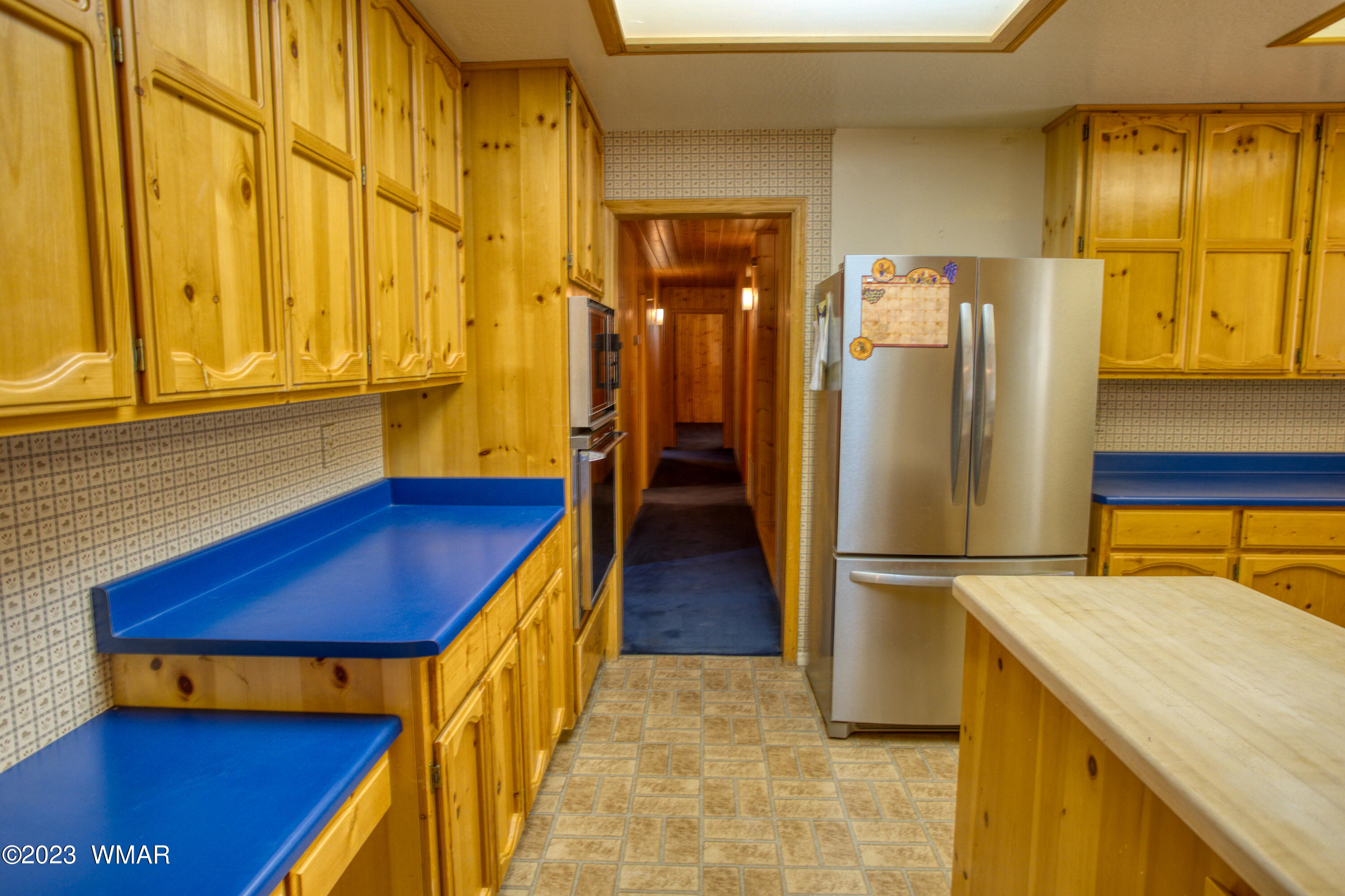 3288 Lake View Drive Pinetop, AZ 85935 - Photo 7 of 32 a kitchen with stainless steel appliances granite countertop a refrigerator and a stove